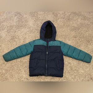 Green and blue puffer jacket